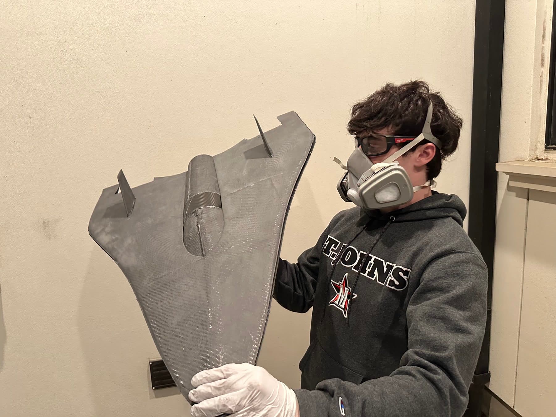 Cristian wearing safety equipment while finishing the carbon-fiber EDF jet airframe