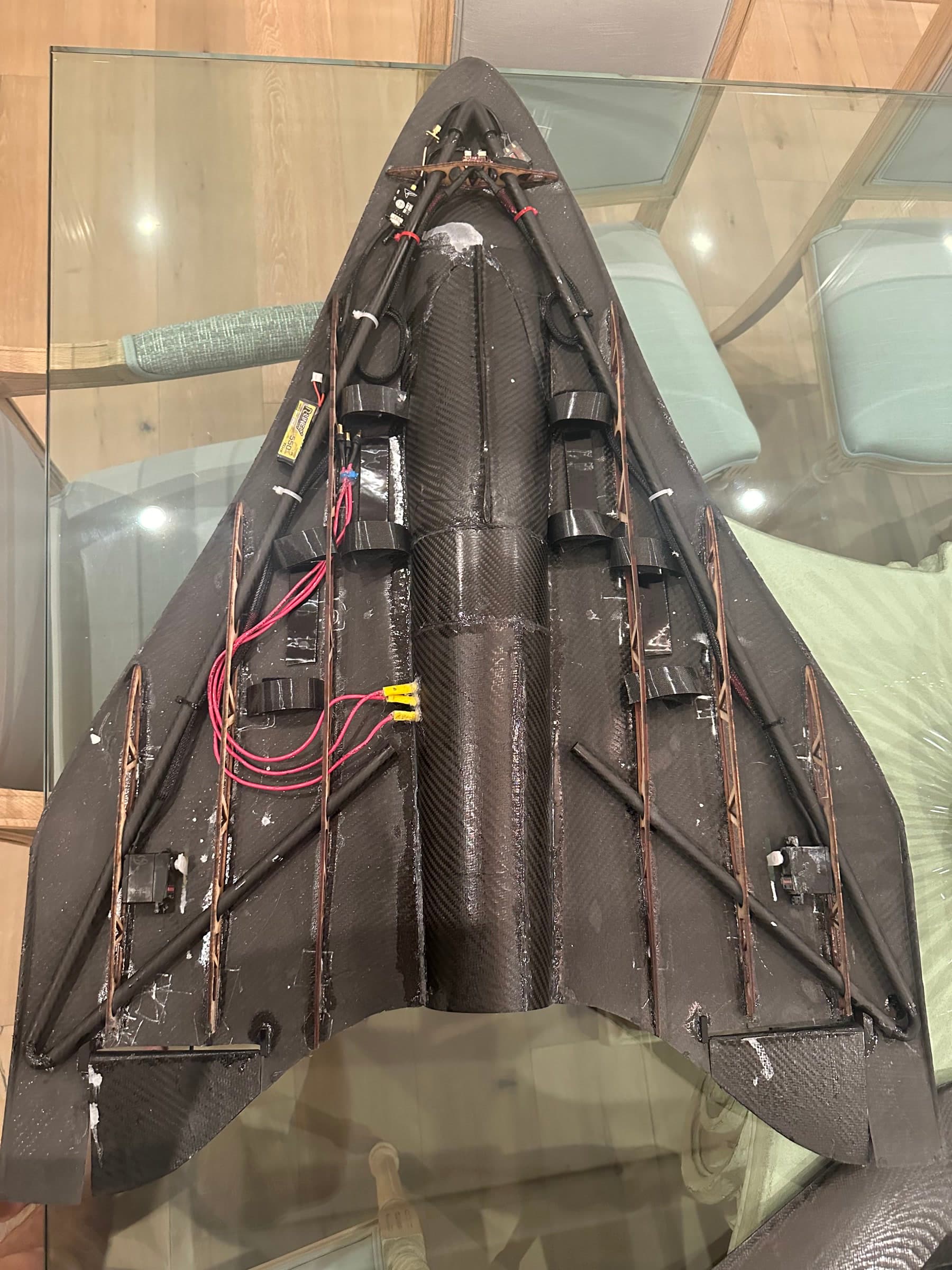 Internal view of the EDF jet showing its ducting, batteries, electronics, and control linkages